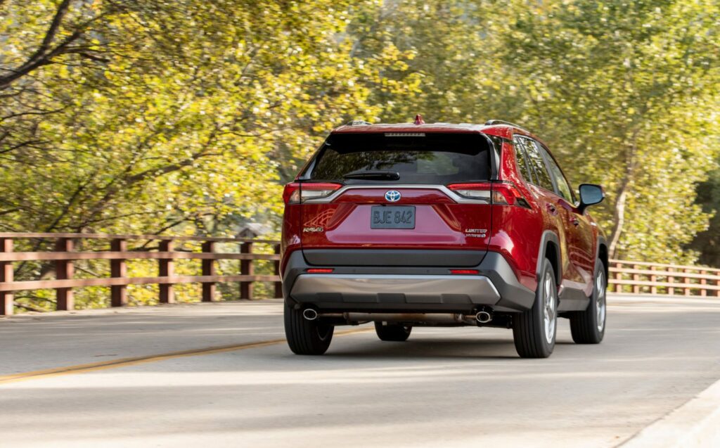ruby flare pearl rav4 driving on road rear view