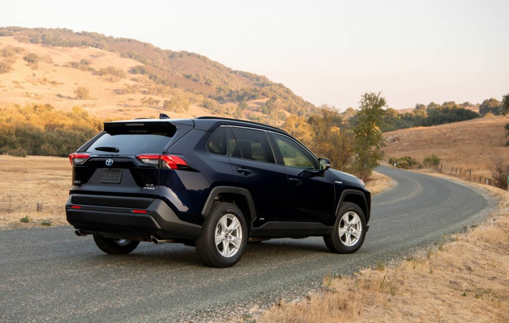 rear right view of blueprint color rav4 parked on road
