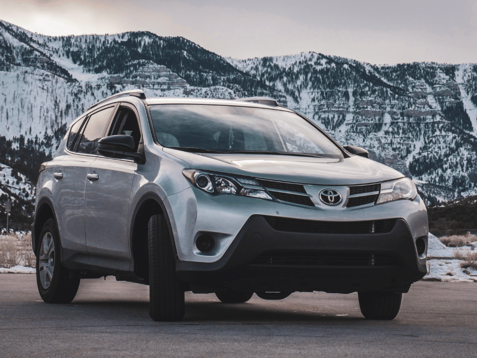 toyota rav4 with mountains in background