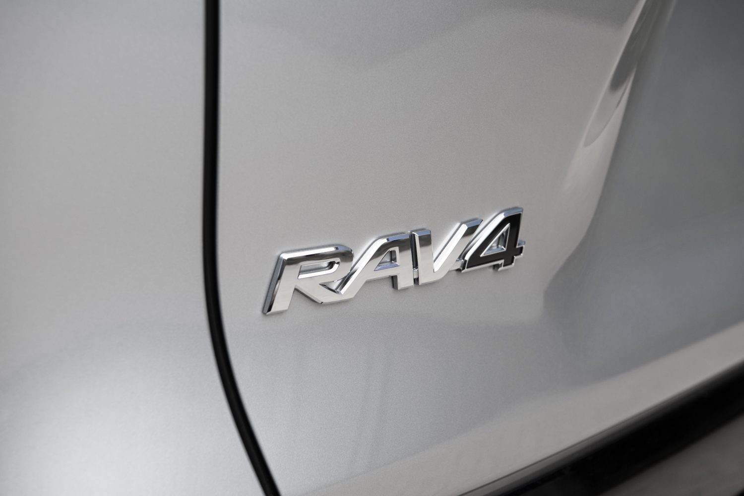 silver sky metallic toyota rav4 logo close up