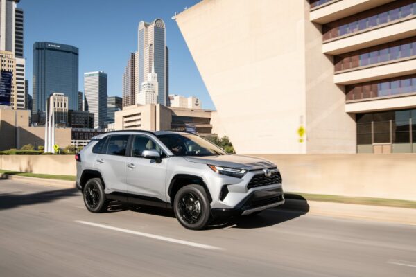 toyota rav4 in silver sky metallic front right view in city driving