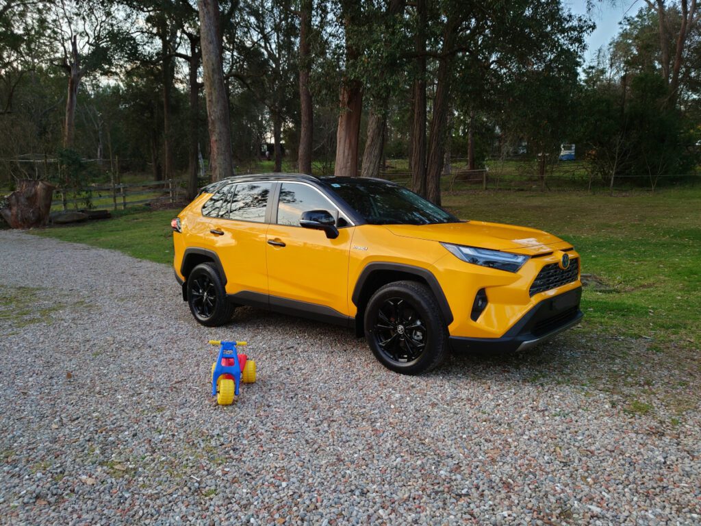 yellow toyota rav4 front right view