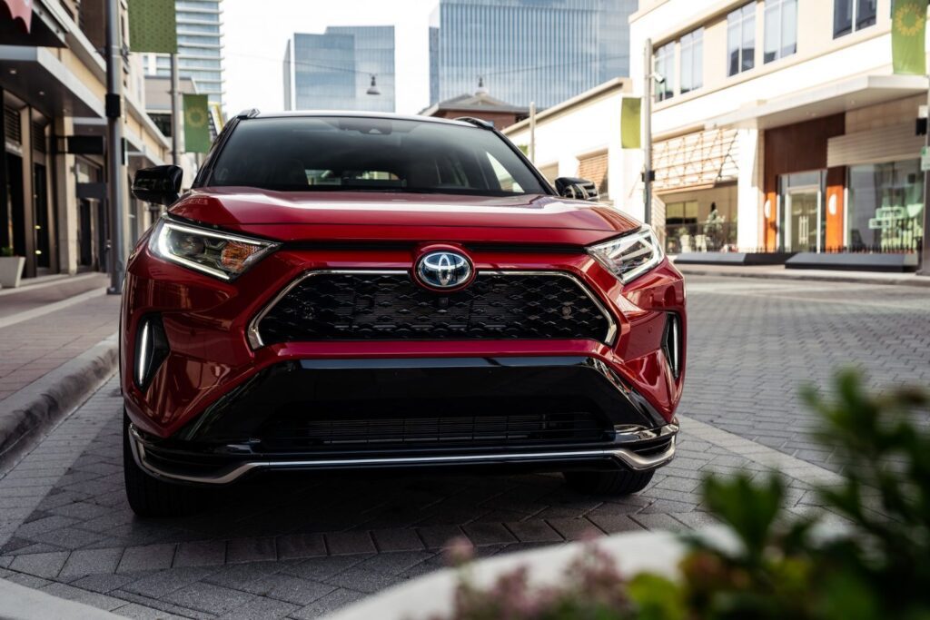 2024 Toyota RAV4 Prime in Supersonic Red, front angle.